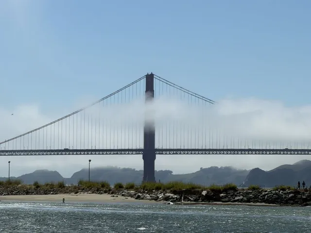 The Golden Gate Bridge in fog seen from Crissy Field
